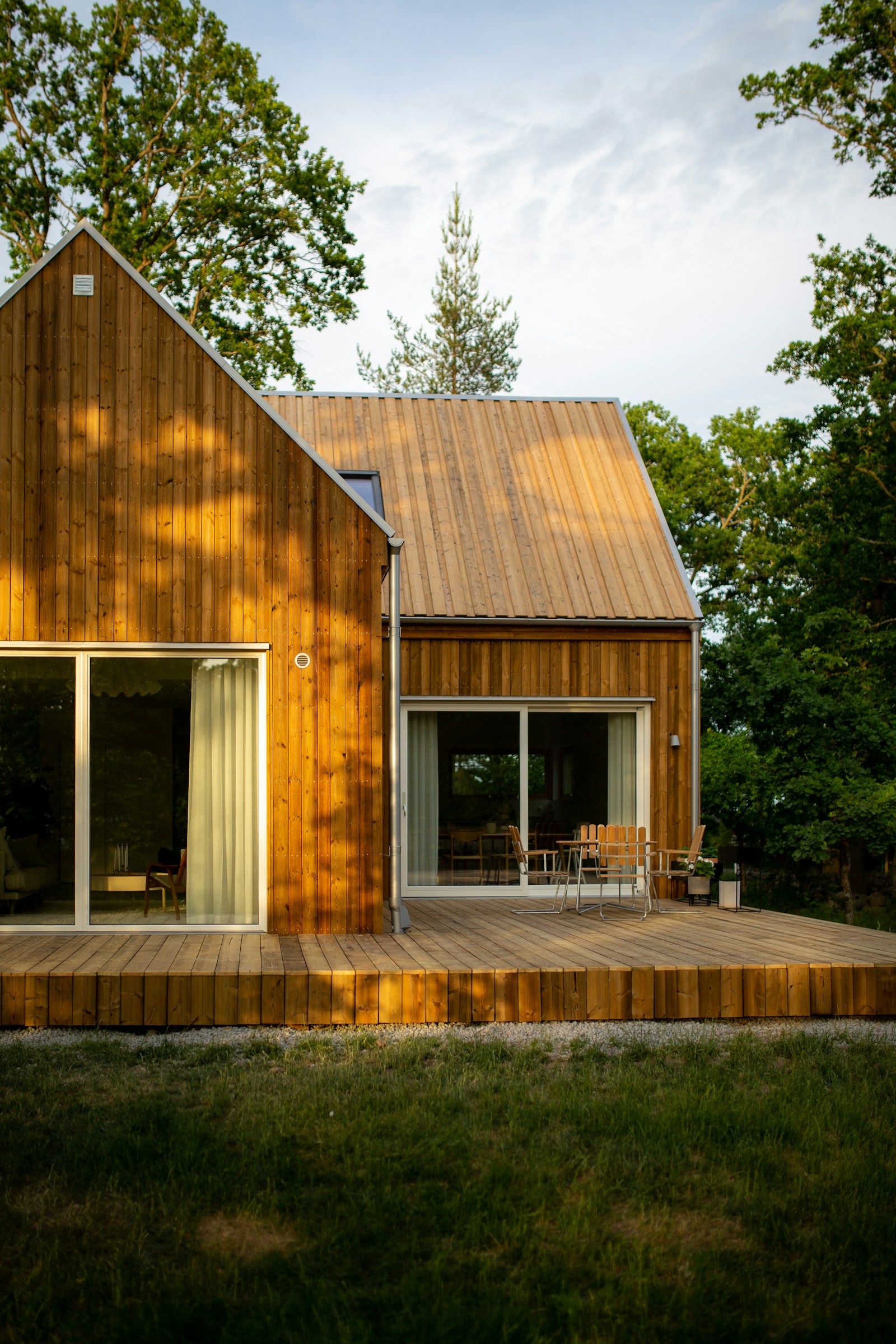 Timber-clad home and deck in a landscaped garden